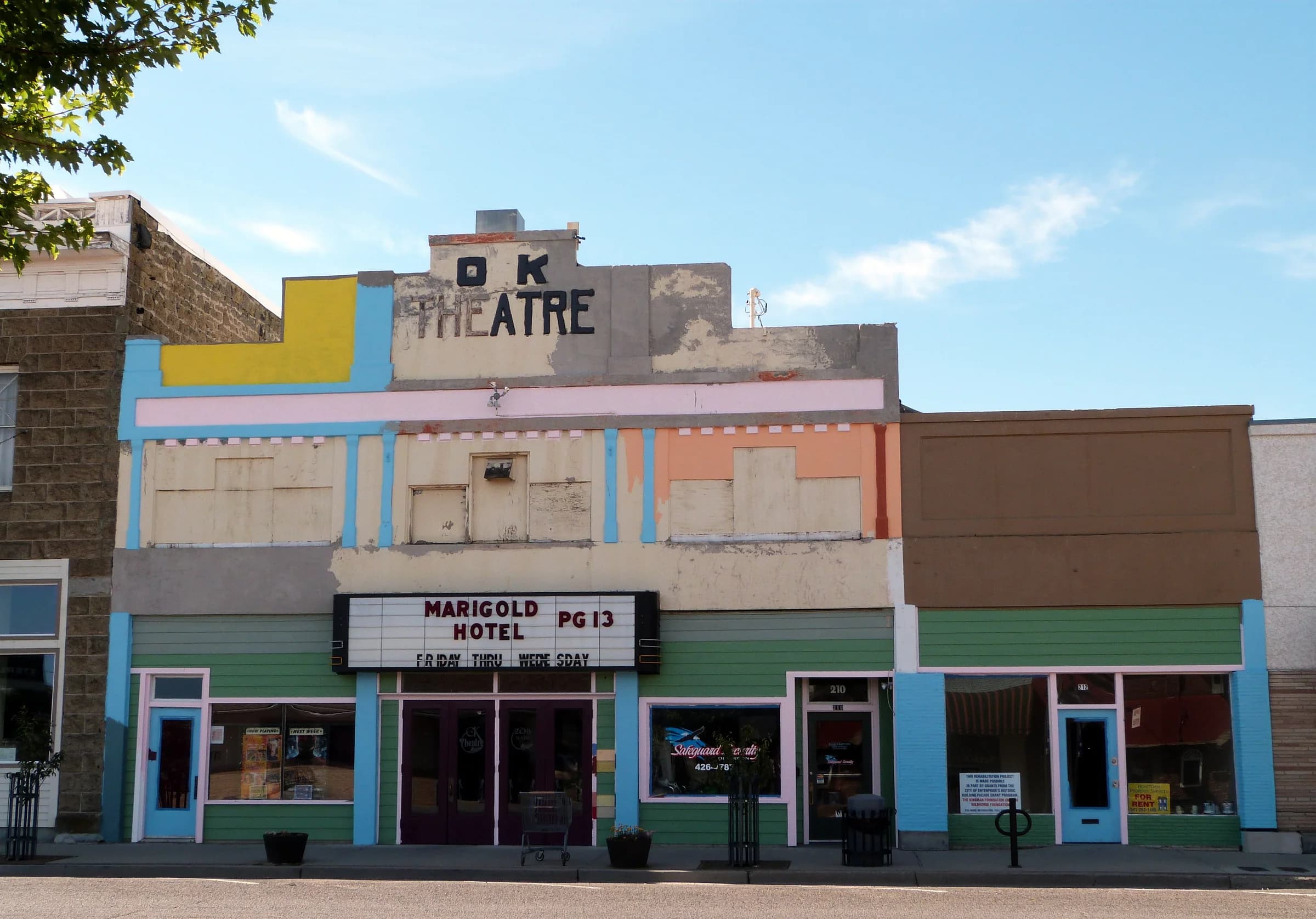 The OK Theatre facade in Enterprise. The marquee records a moment in the past, not a current program.
