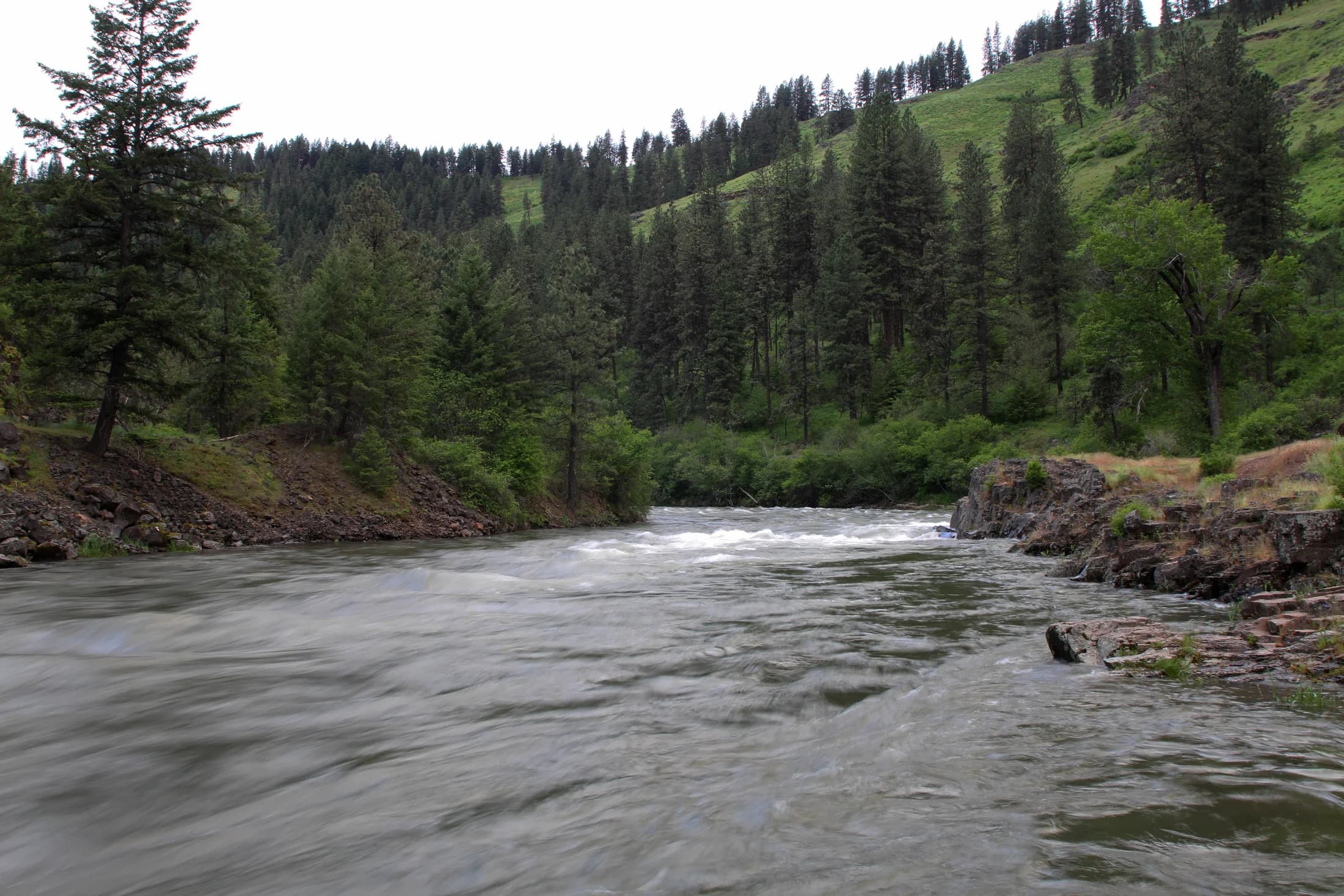 The Wallowa River, shown as regional landscape context. Portraits and historical photographs remain with their original collections.